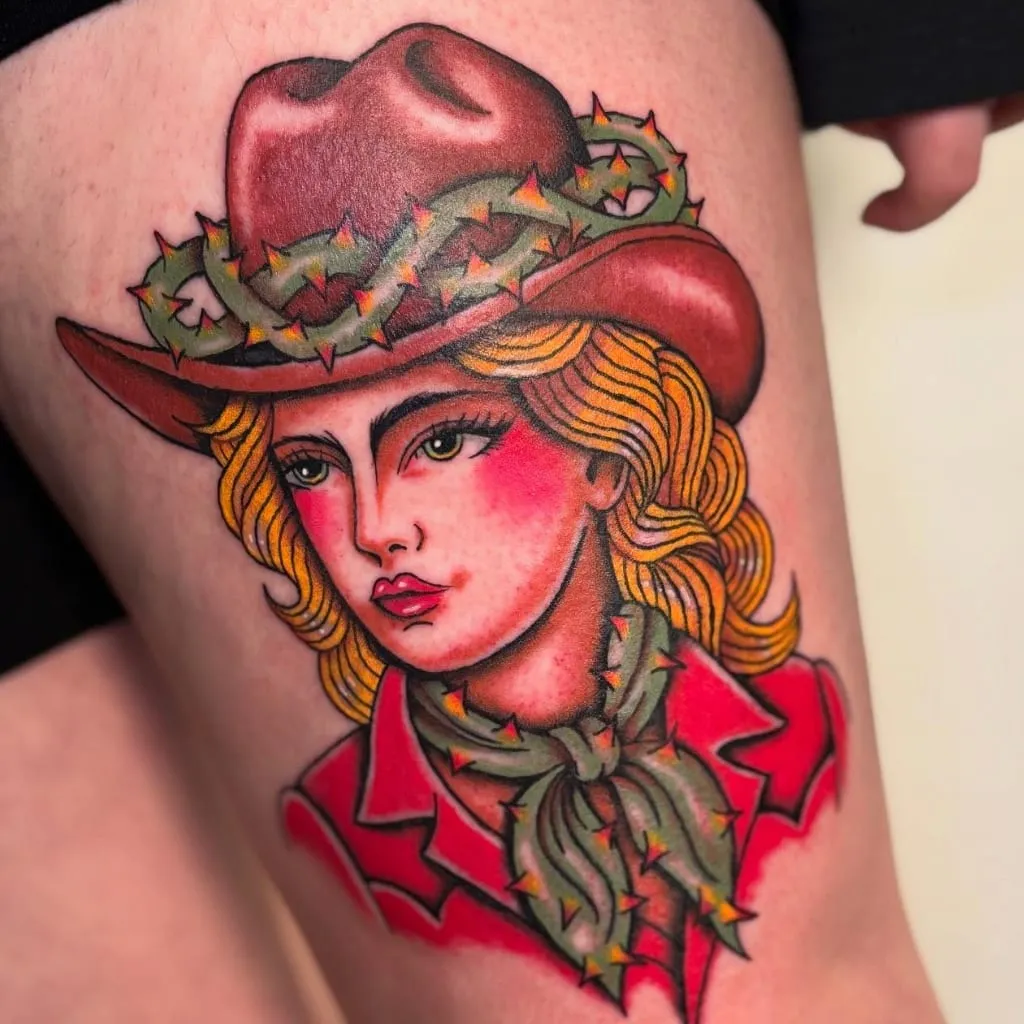 Traditional cowgirl portrait in a red hat and thorn-covered scarf, on a thigh