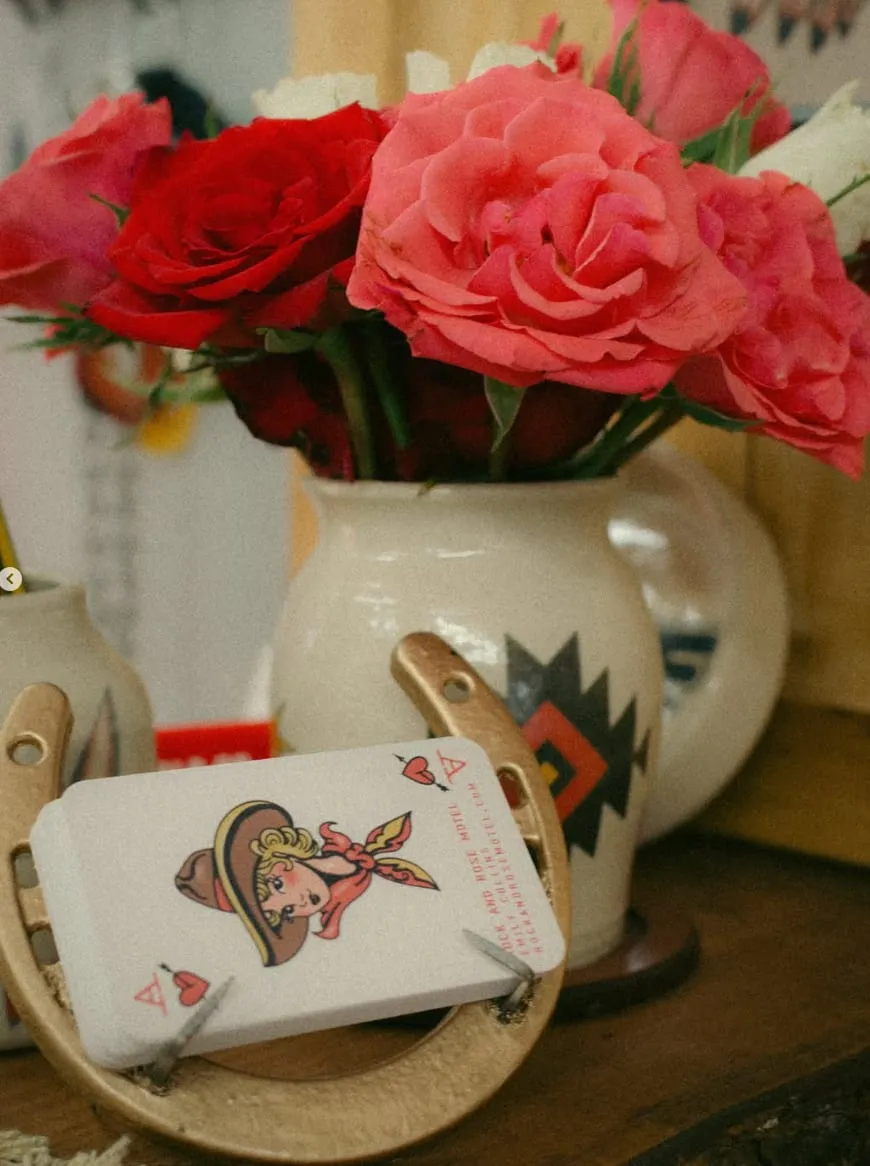 Playing cards and roses on the counter