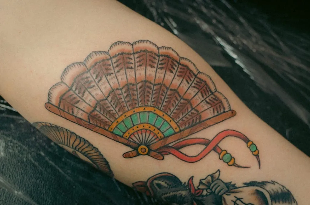 Traditional full colour turkey feather fan tattoo